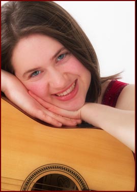 Aine Woods with her guitar.